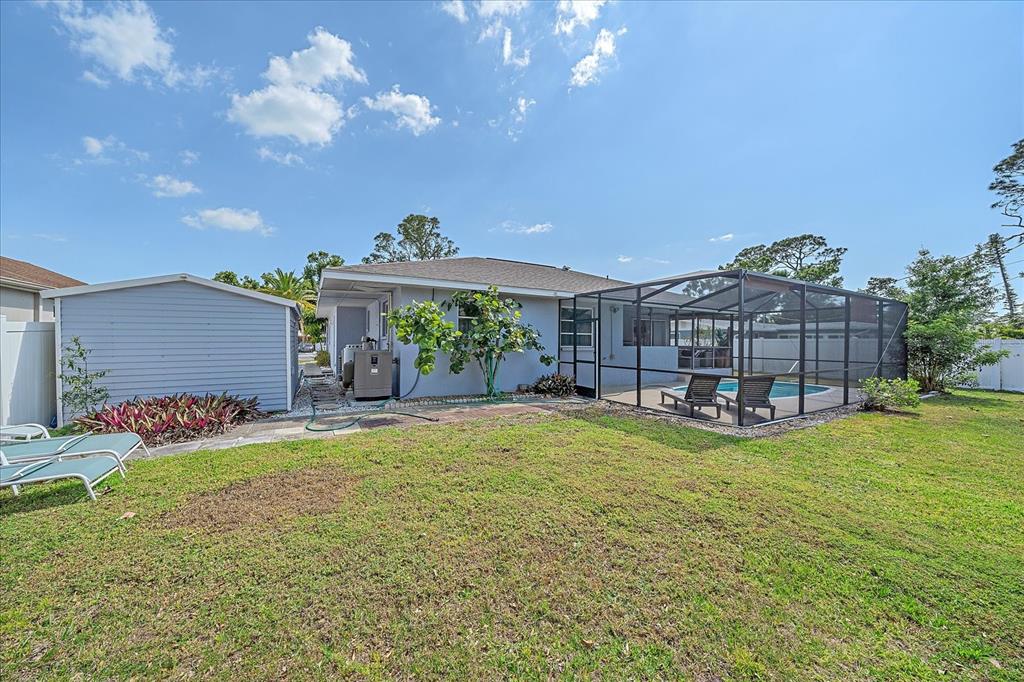 108 Stanford Road Venice, FL 34293 - Photo 28 of 28 a view of a house with swimming pool and sitting area