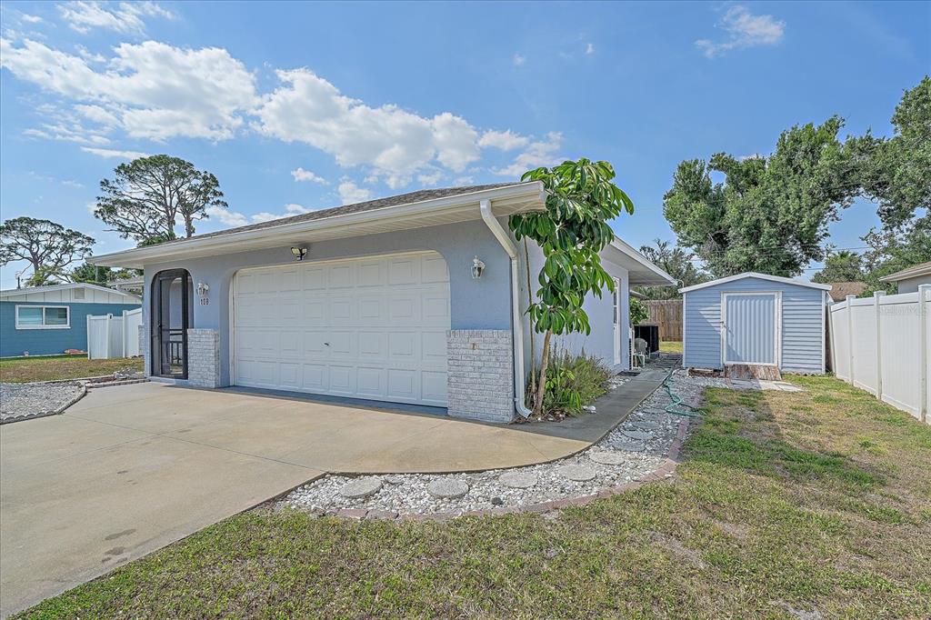 108 Stanford Road Venice, FL 34293 - Photo 3 of 28 a front view of a house with a yard and garage