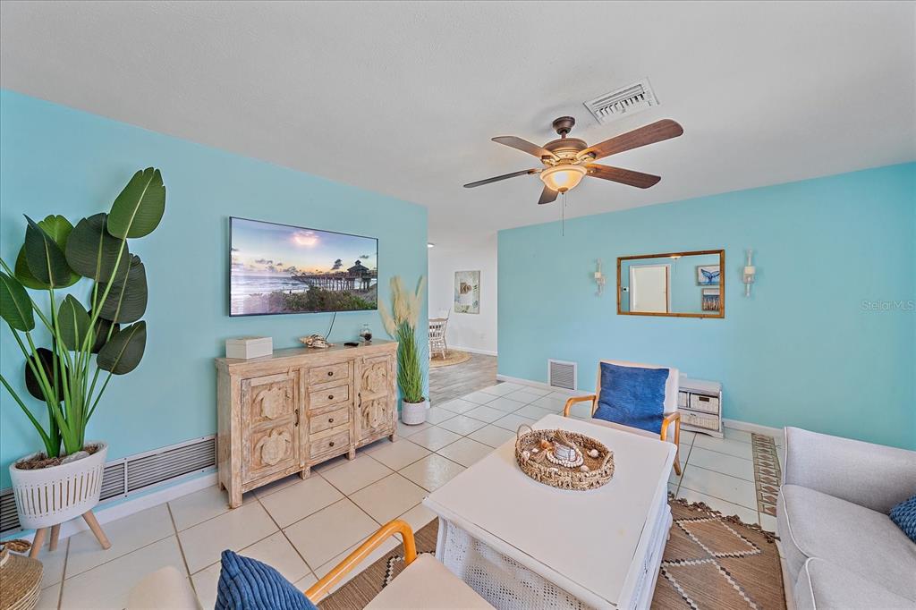 108 Stanford Road Venice, FL 34293 - Photo 5 of 28 a living room with furniture and a flat screen tv