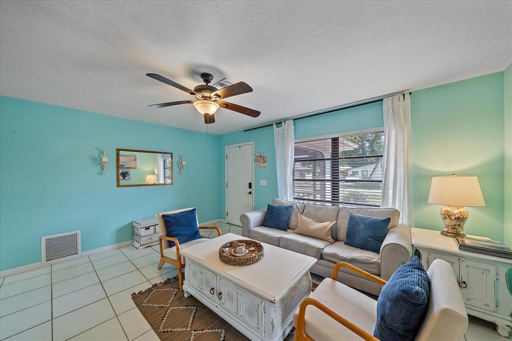 108 Stanford Road Venice, FL 34293 - Photo 6 of 28 a living room with furniture and a window