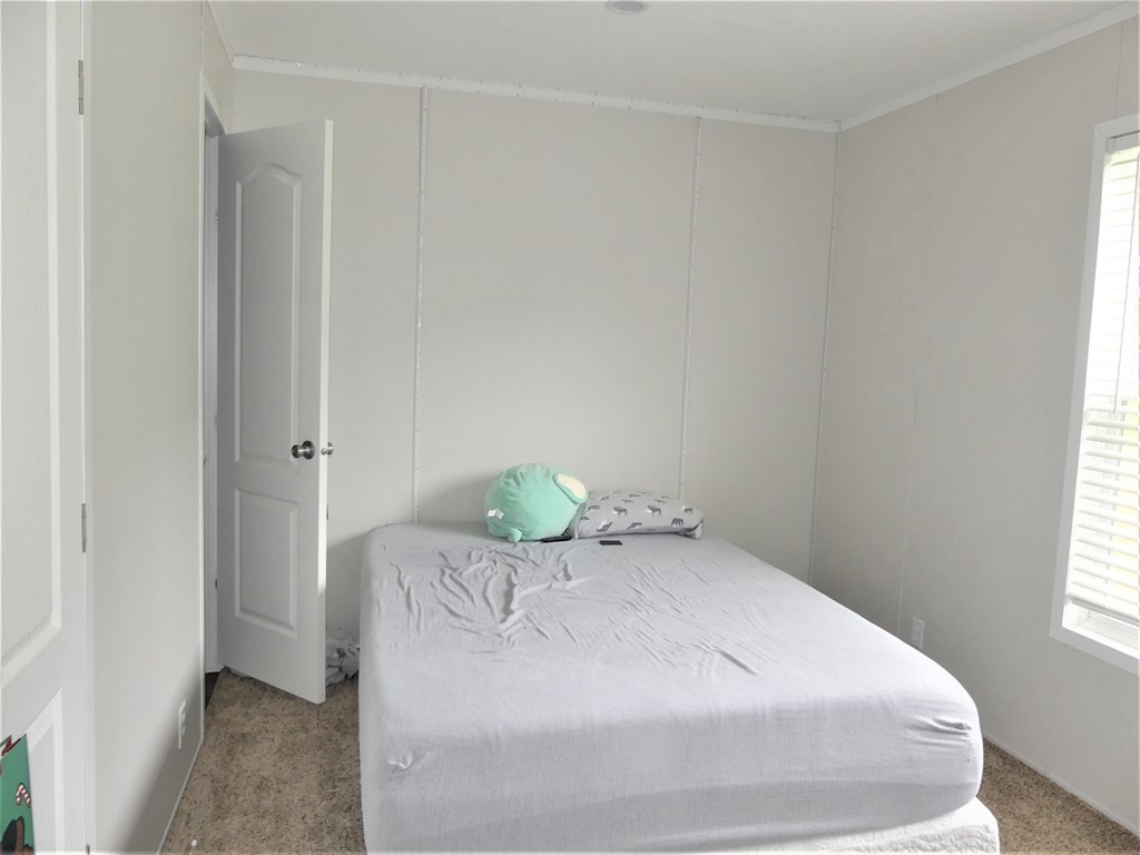 211 Cottonport Ferry Road Decatur, TN 37322 - Photo 19 of 41 a bedroom with a bed and hallway