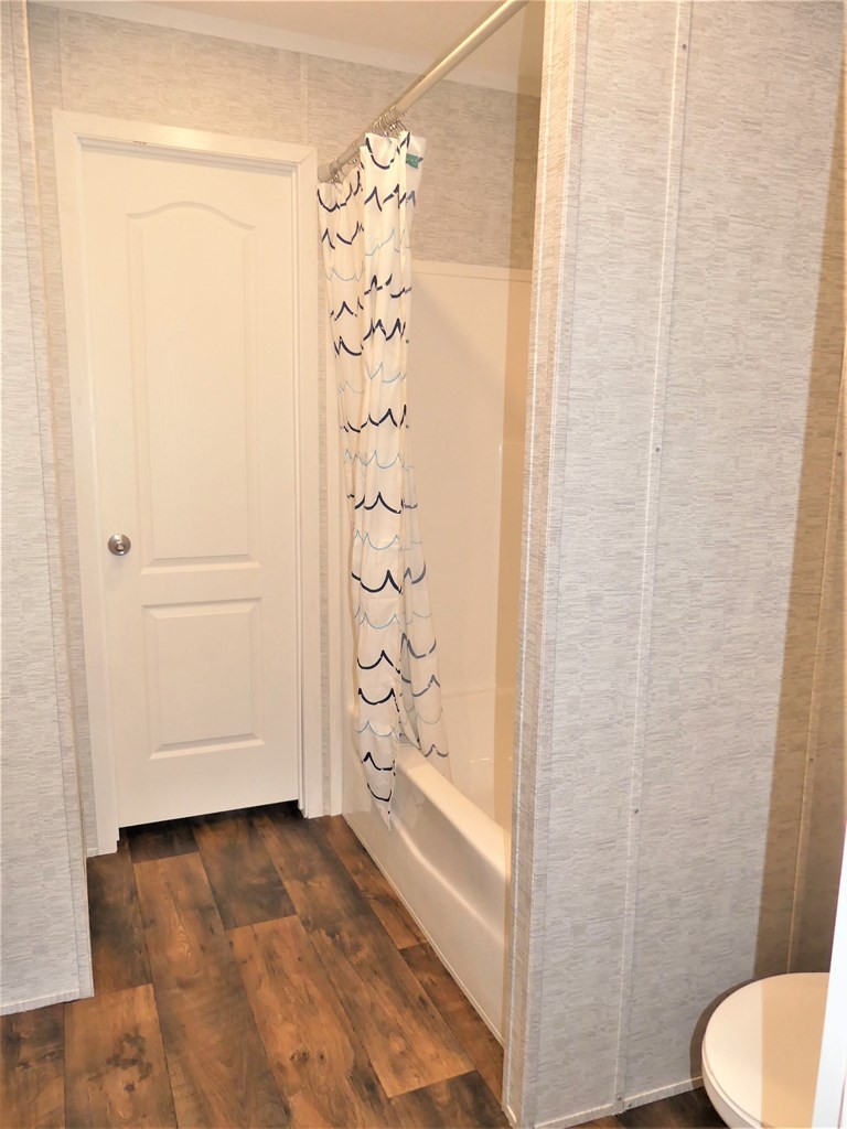 211 Cottonport Ferry Road Decatur, TN 37322 - Photo 21 of 41 a bathroom with a shower curtain