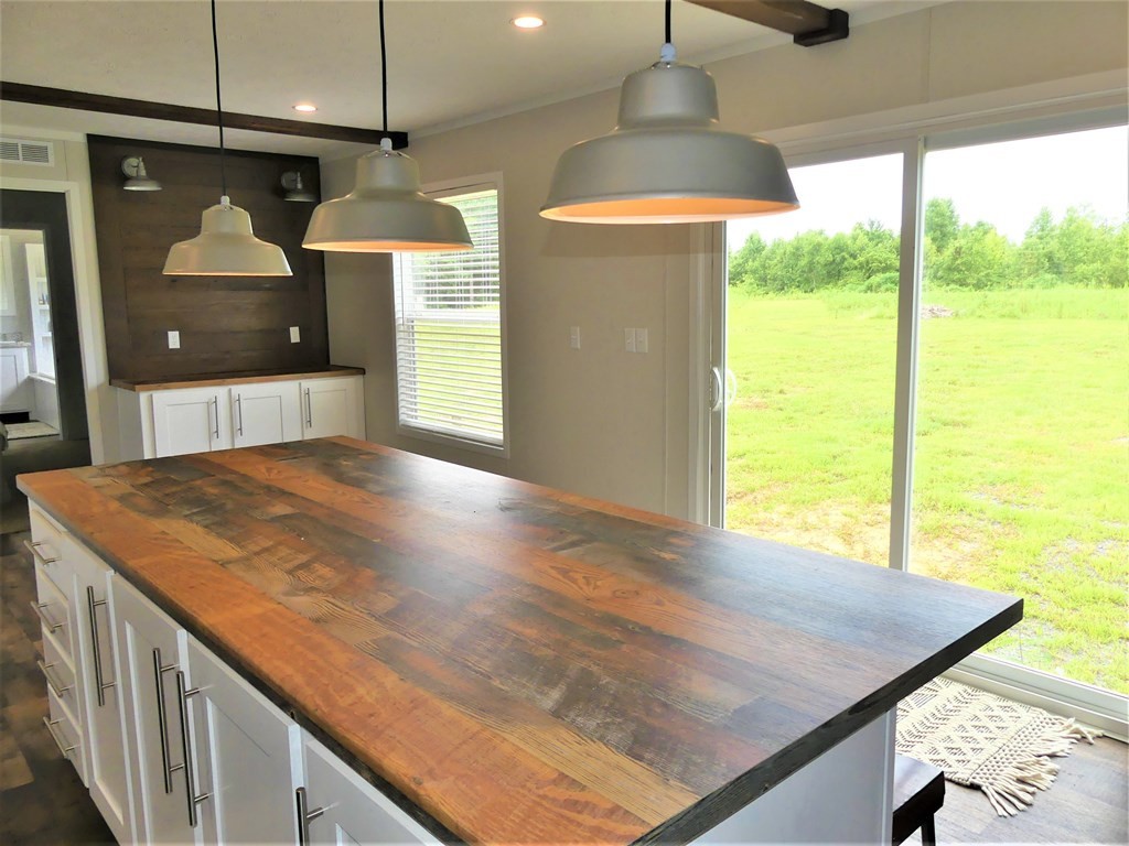 211 Cottonport Ferry Road Decatur, TN 37322 - Photo 9 of 41 a view of a kitchen with a sink and wooden floor