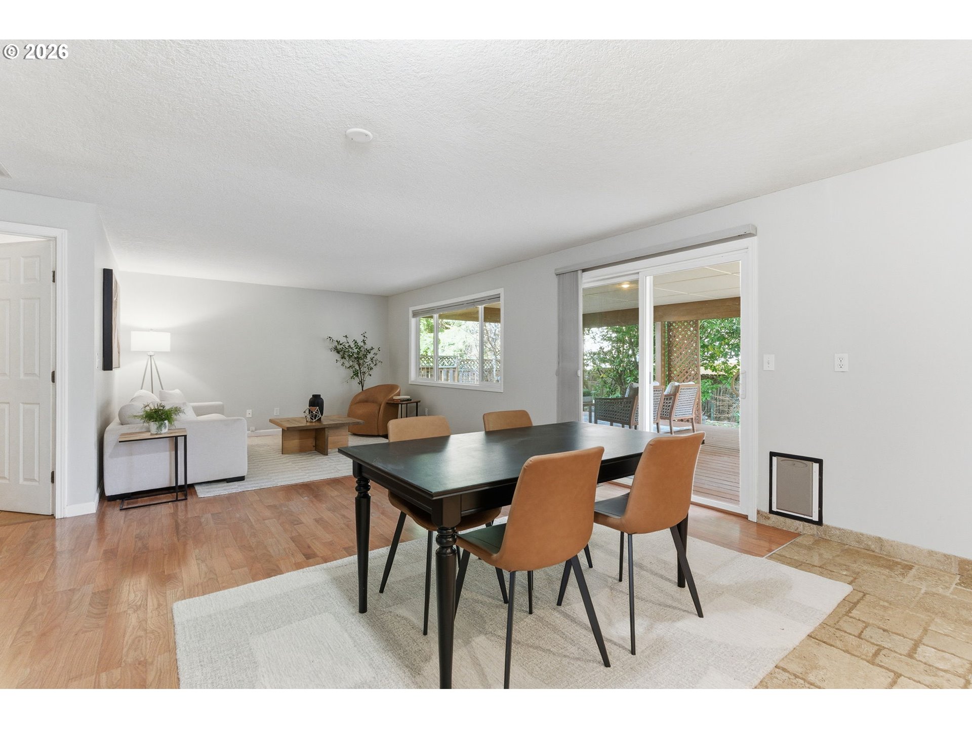 5585 Northwest Peregrine Place Portland, OR 97229 - Photo 21 of 47 a view of a dining room with furniture and wooden floor