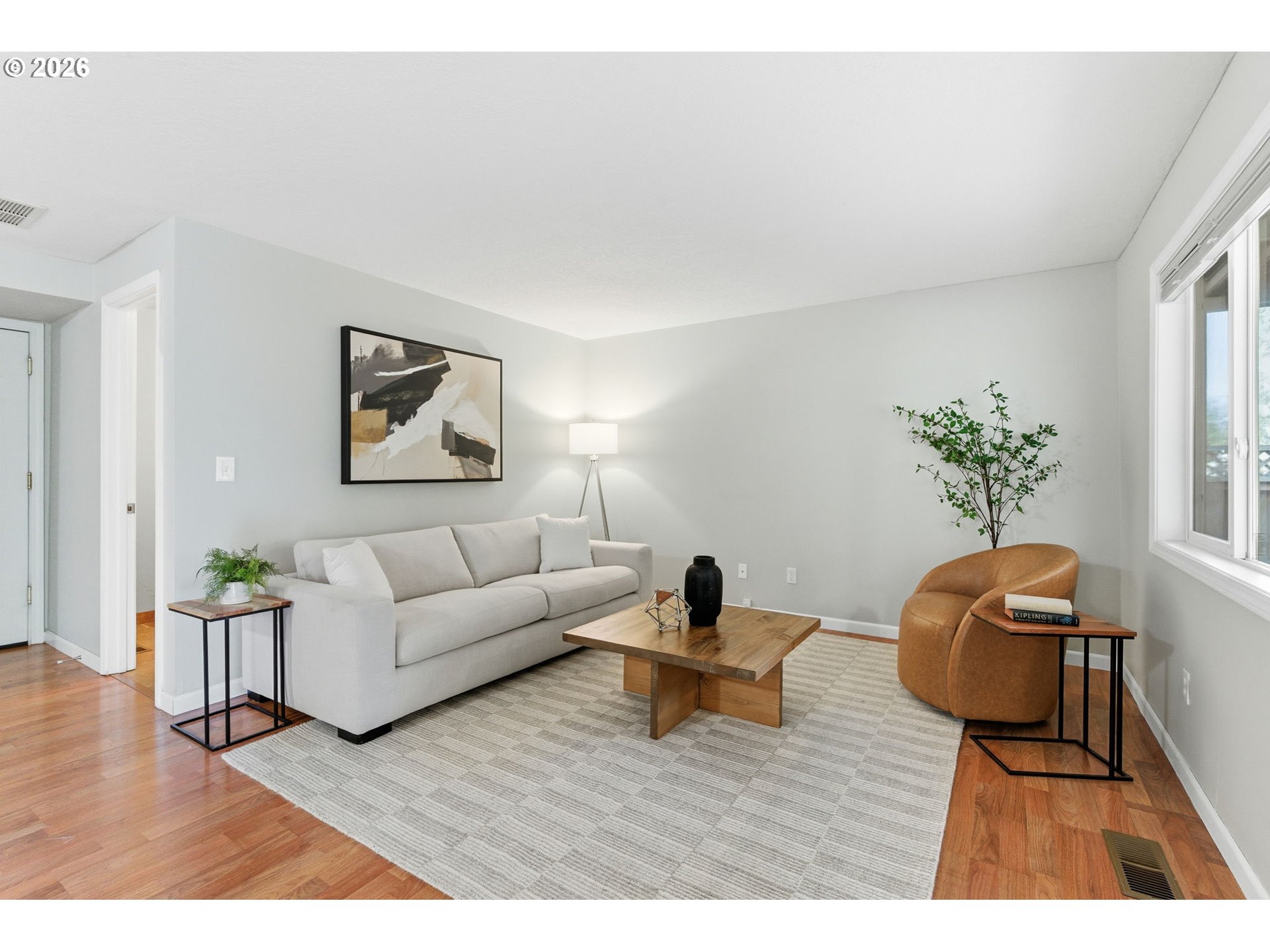 5585 Northwest Peregrine Place Portland, OR 97229 - Photo 23 of 47 a living room with furniture and a potted plant