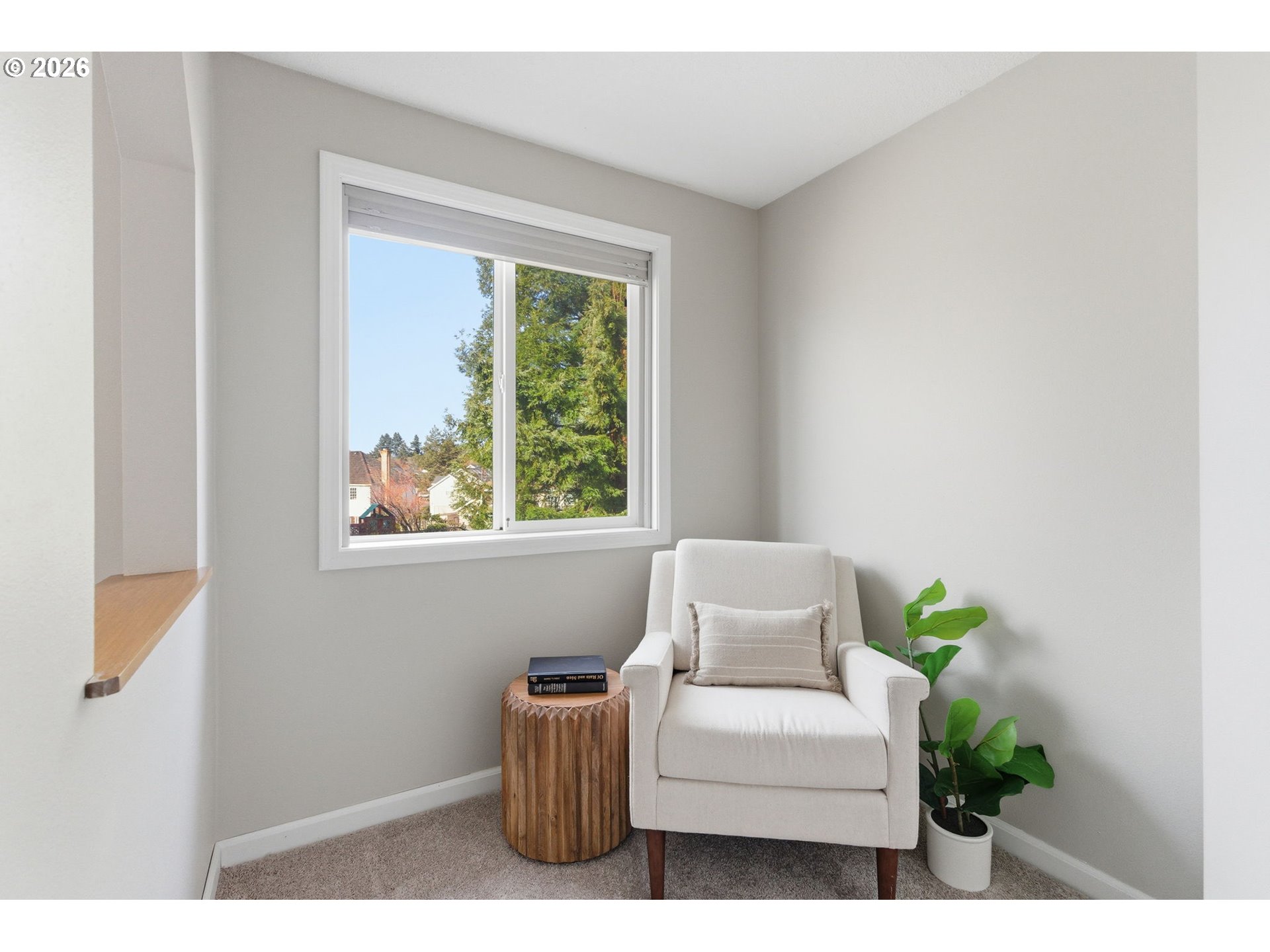 5585 Northwest Peregrine Place Portland, OR 97229 - Photo 32 of 47 a living room with furniture and a window