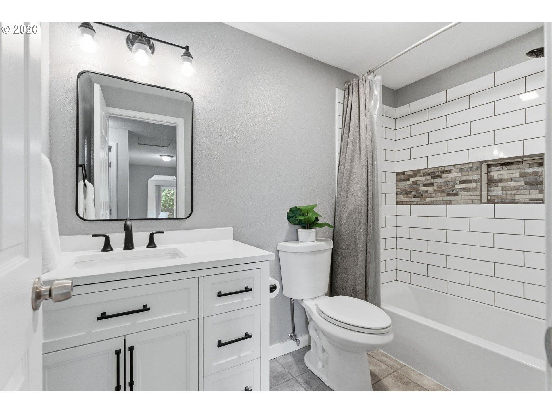 5585 Northwest Peregrine Place Portland, OR 97229 - Photo 36 of 47 a bathroom with a sink a toilet a mirror and shower