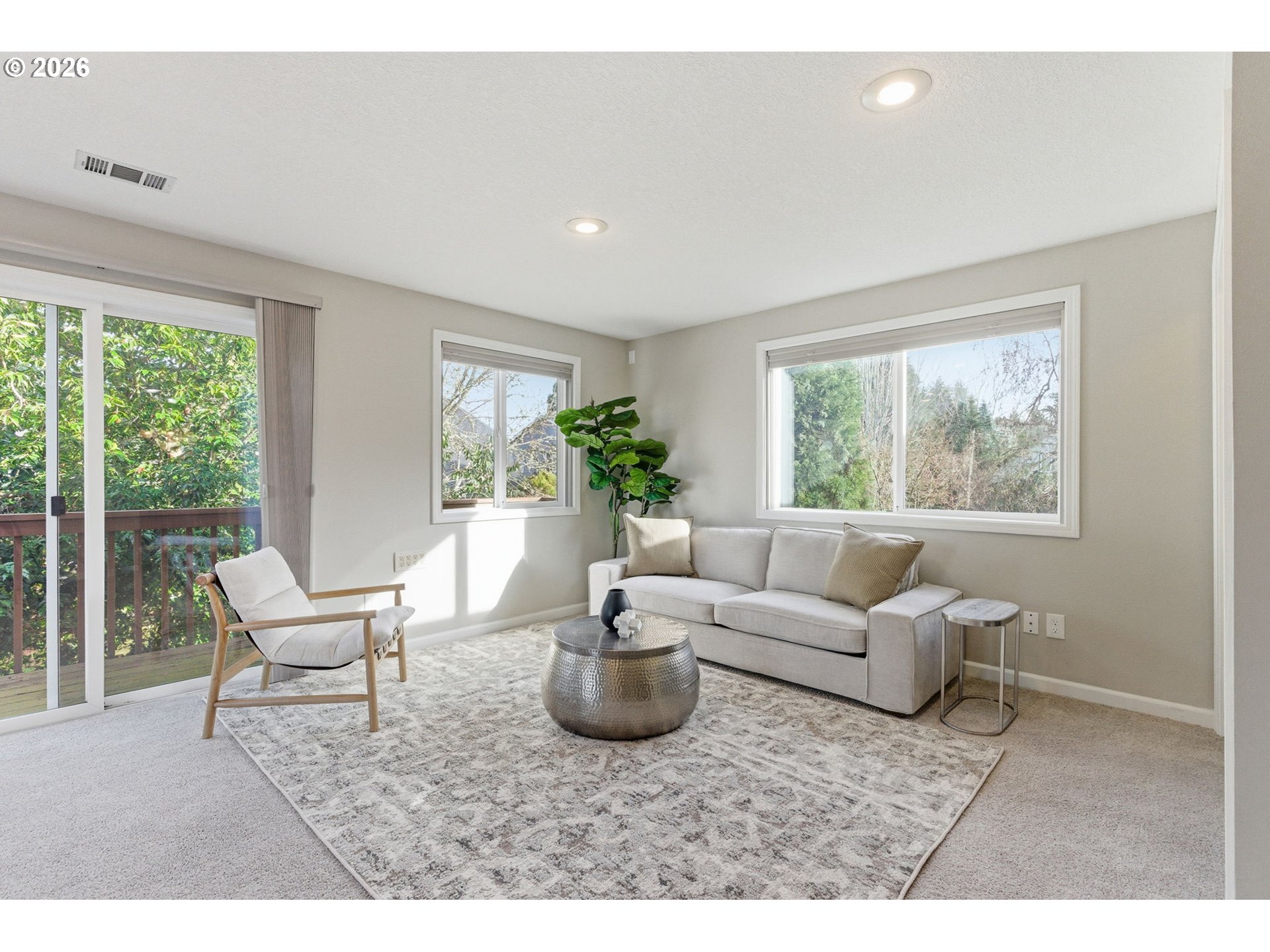 5585 Northwest Peregrine Place Portland, OR 97229 - Photo 41 of 47 a living room with furniture and a large window
