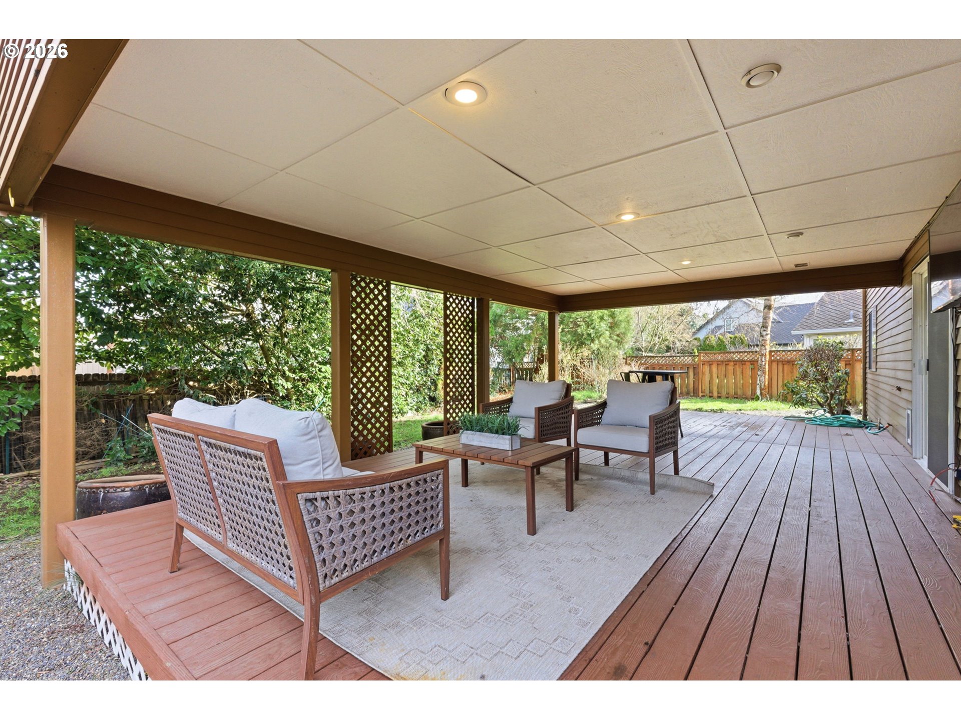 5585 Northwest Peregrine Place Portland, OR 97229 - Photo 45 of 47 a balcony with wooden floor and outdoor seating