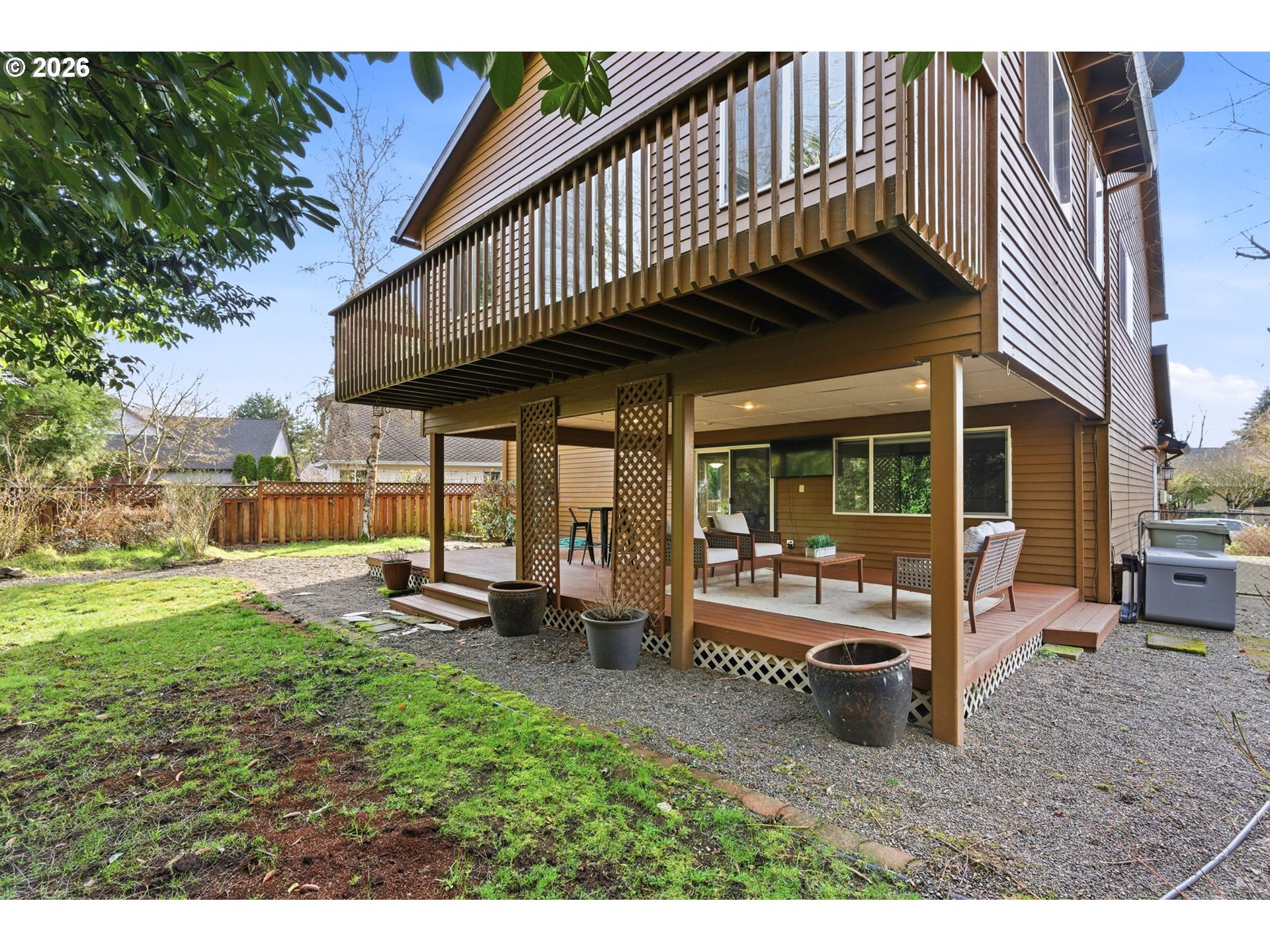 5585 Northwest Peregrine Place Portland, OR 97229 - Photo 46 of 47 a view of a house with backyard porch and sitting area