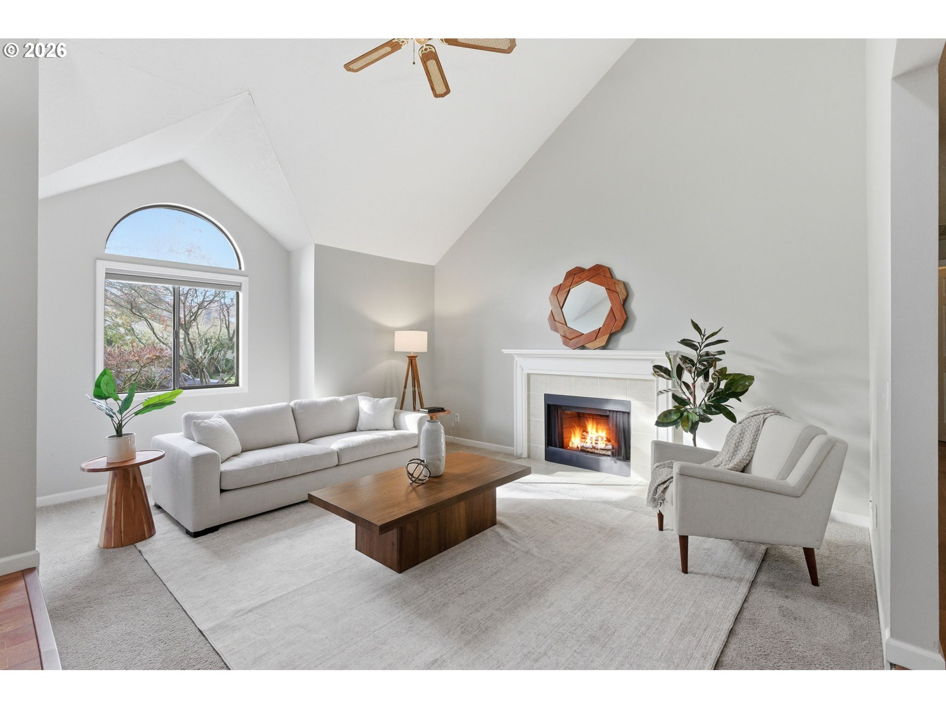 5585 Northwest Peregrine Place Portland, OR 97229 - Photo 9 of 47 a living room with furniture a fireplace and a window