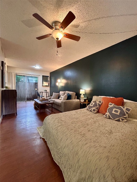 a bedroom with double bed and a large window