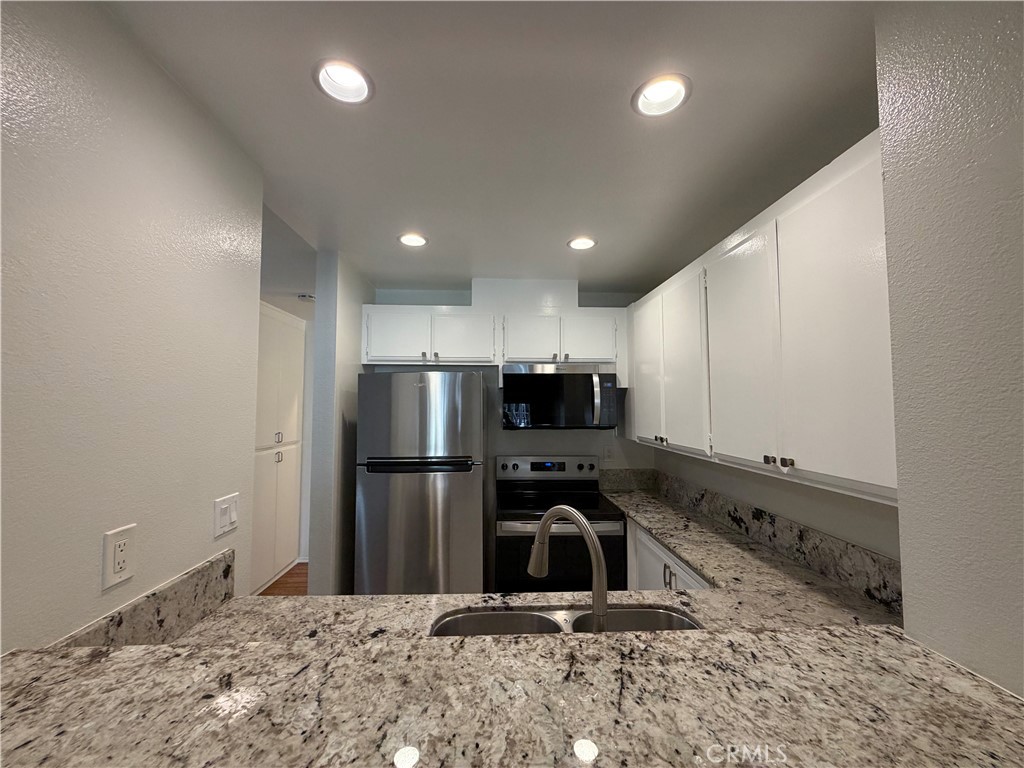 7890 East Spring Street, Unit 4O Long Beach, CA 90815 - Photo 3 of 38 All New Stainless Appliances, Dishwasher, Elec Stove, Refrigerator