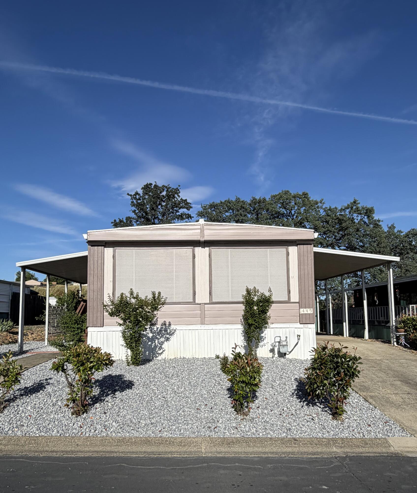 front view of a house with a yard