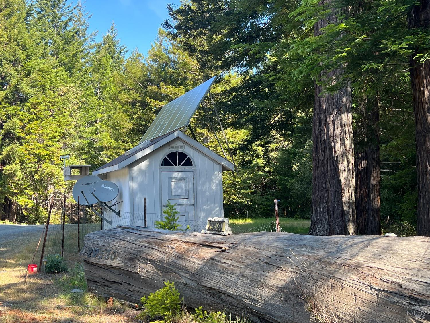 29530 Ten Mile Cut Off Road Gualala, CA 95445 - Photo 1 of 1 a view of a house with a tree in the background