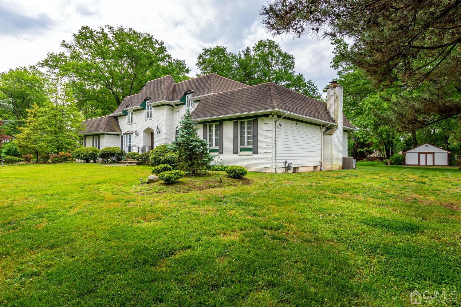 355 New Dover Road Colonia, NJ 07067 - Photo 3 of 45 a house view with a garden space