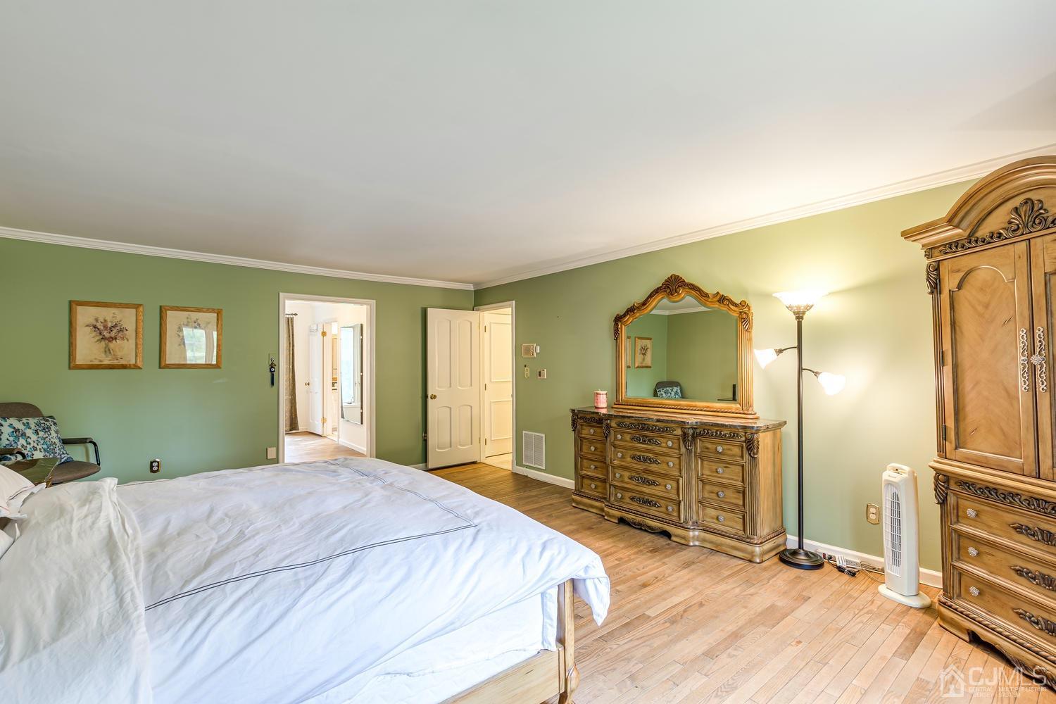 355 New Dover Road Colonia, NJ 07067 - Photo 29 of 45 a bedroom with a bed and a dresser