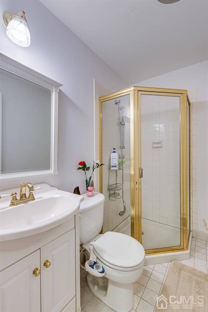355 New Dover Road Colonia, NJ 07067 - Photo 33 of 45 a bathroom with a sink toilet and shower