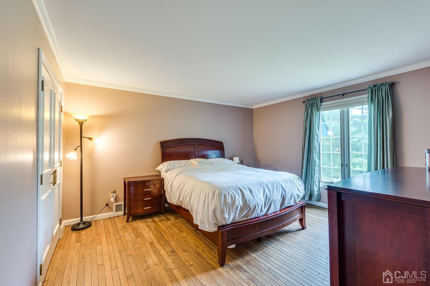 355 New Dover Road Colonia, NJ 07067 - Photo 34 of 45 a bedroom with a bed and large window