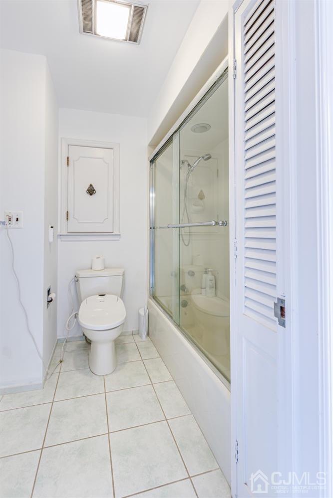 355 New Dover Road Colonia, NJ 07067 - Photo 36 of 45 a bathroom with a toilet a sink and shower