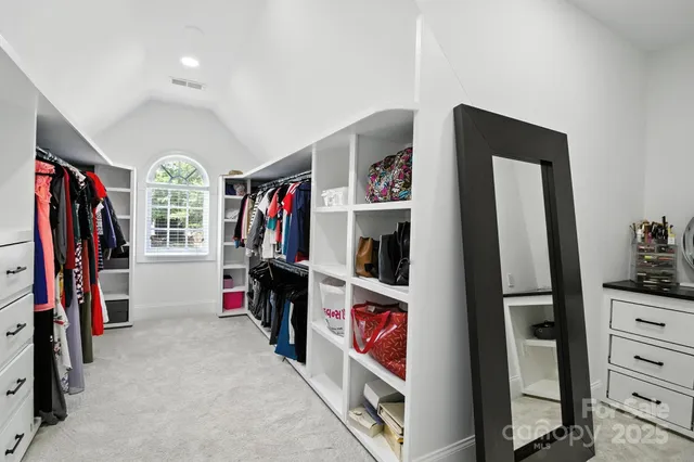 a view of a livingroom with furniture and closet