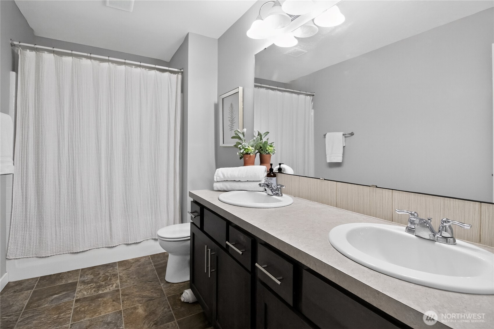25900 243rd Avenue Southeast Maple Valley, WA 98038 - Photo 16 of 23 a bathroom with a double vanity sink and a mirror