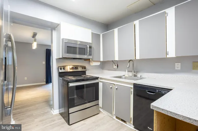 a kitchen with a stove and a sink