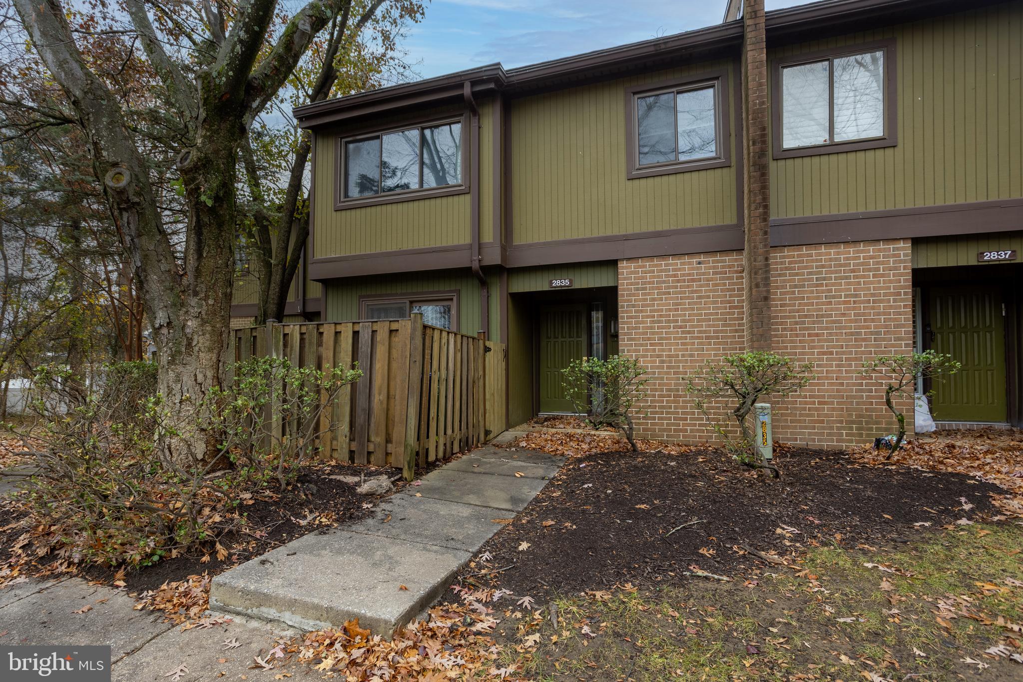 2835 Baneberry Court Baltimore, MD 21209 - Photo 2 of 42 a front view of a house with a yard
