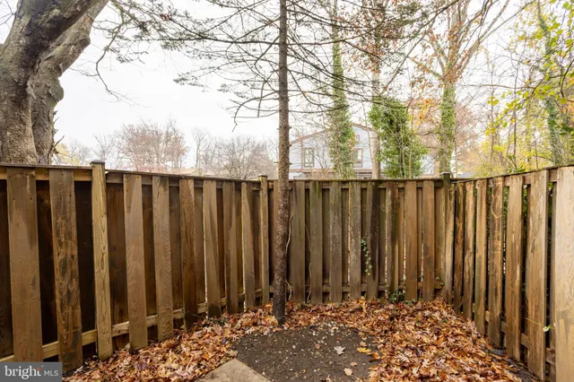 a backyard of a house with yard and outdoor seating