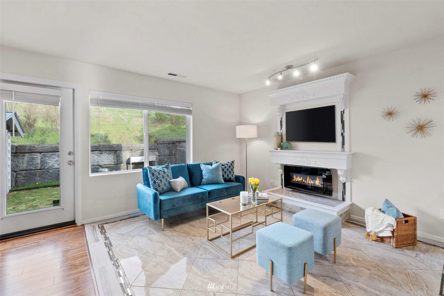 4139 Everett Avenue Tacoma, WA 98404 - Photo 3 of 23 a living room with furniture a fireplace and a flat screen tv