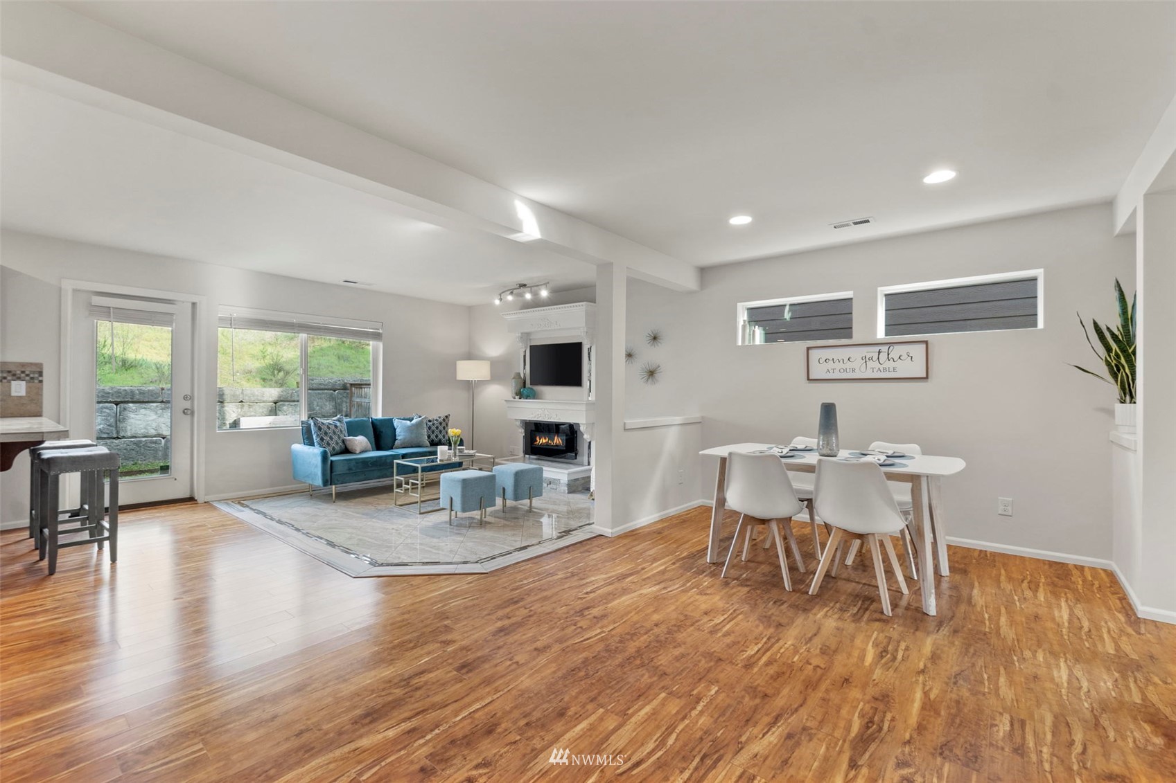 4139 Everett Avenue Tacoma, WA 98404 - Photo 7 of 23 a view of a dining room with furniture and wooden floor