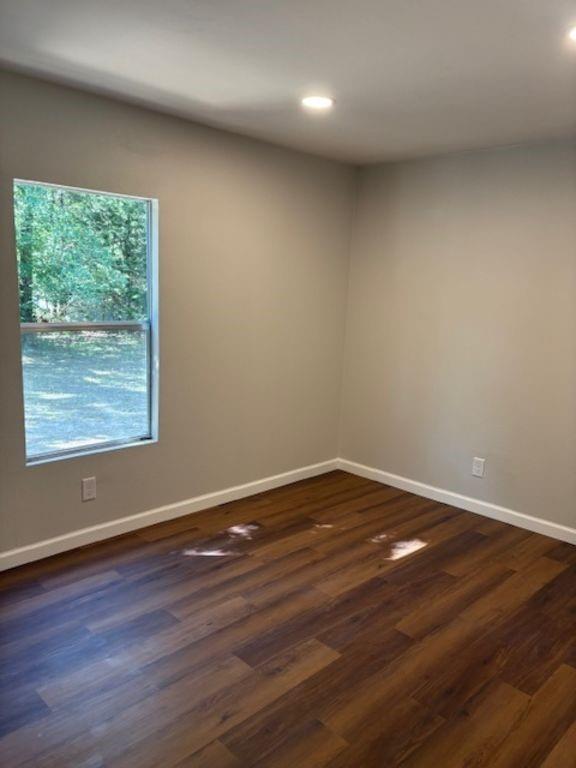 211 VZ County Road 3725 Wills Point, TX 75169 - Photo 13 of 16 a view of an empty room with wooden floor and a window