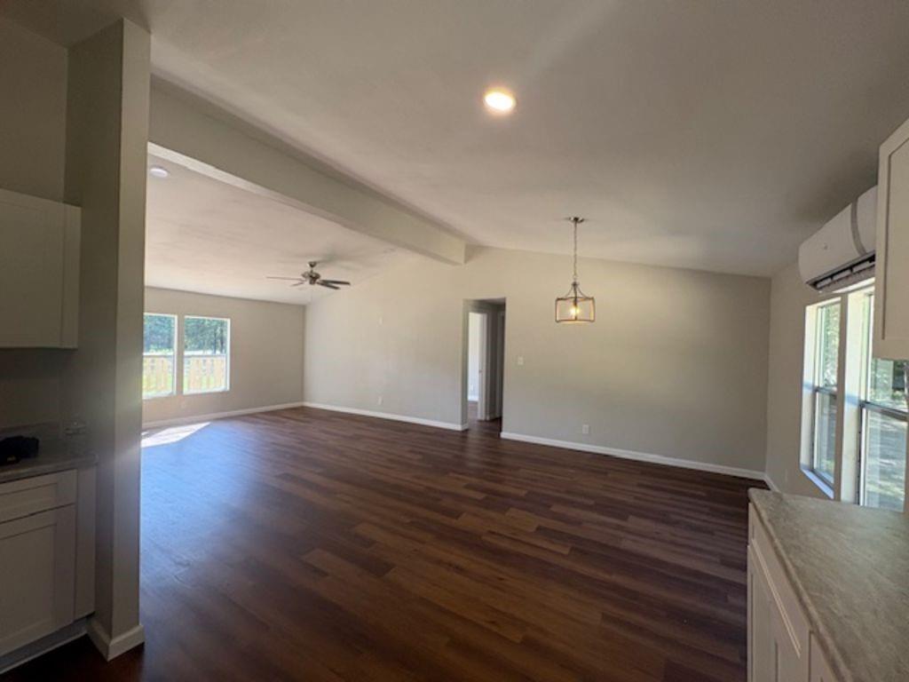 211 VZ County Road 3725 Wills Point, TX 75169 - Photo 4 of 16 wooden floor in an empty room with a window