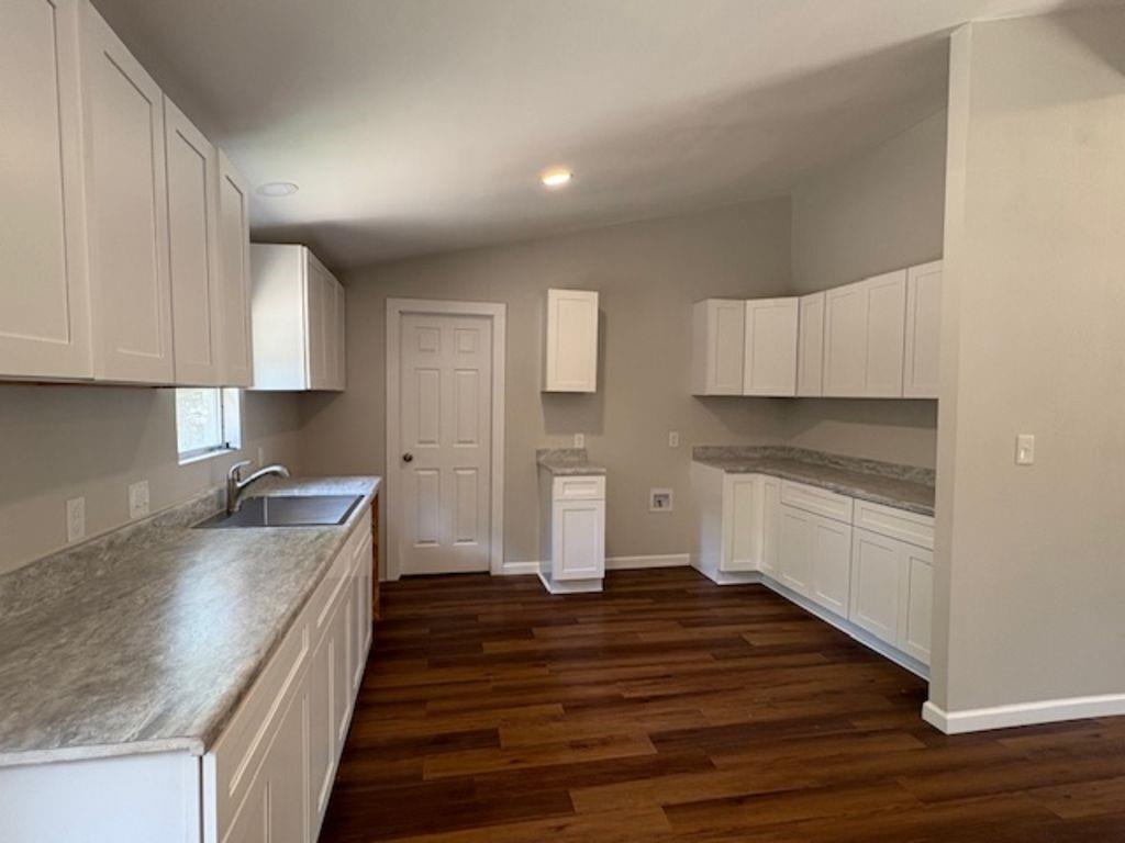211 VZ County Road 3725 Wills Point, TX 75169 - Photo 5 of 16 a kitchen with granite countertop a sink and cabinets
