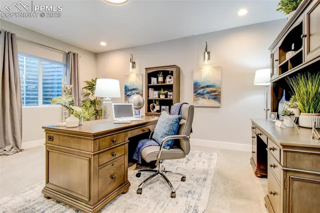 a view of a workspace with furniture
