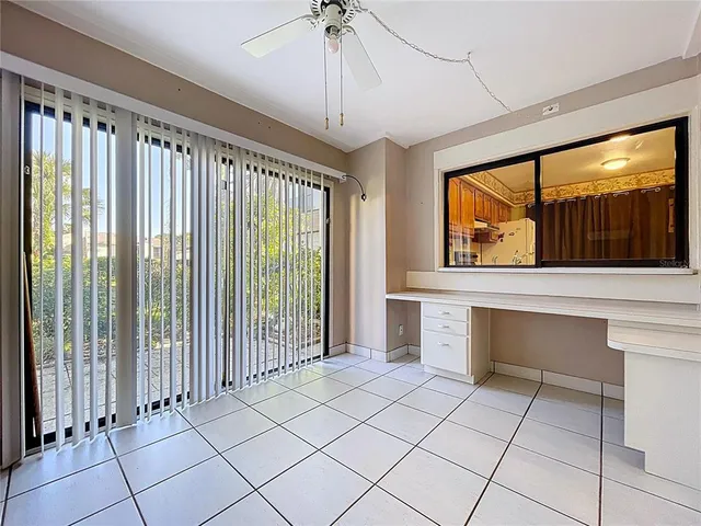a kitchen with granite countertop stainless steel appliances and wooden cabinets