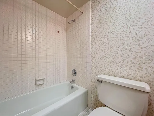 a swimming pool with outdoor seating and yard