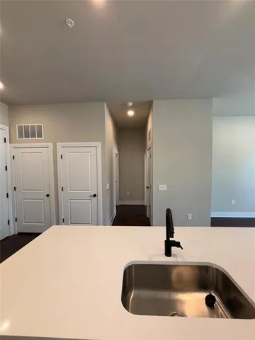 a bathroom with a sink and a large mirror