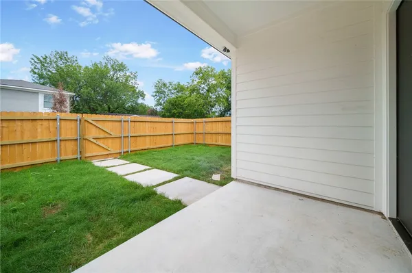a view of backyard with green space