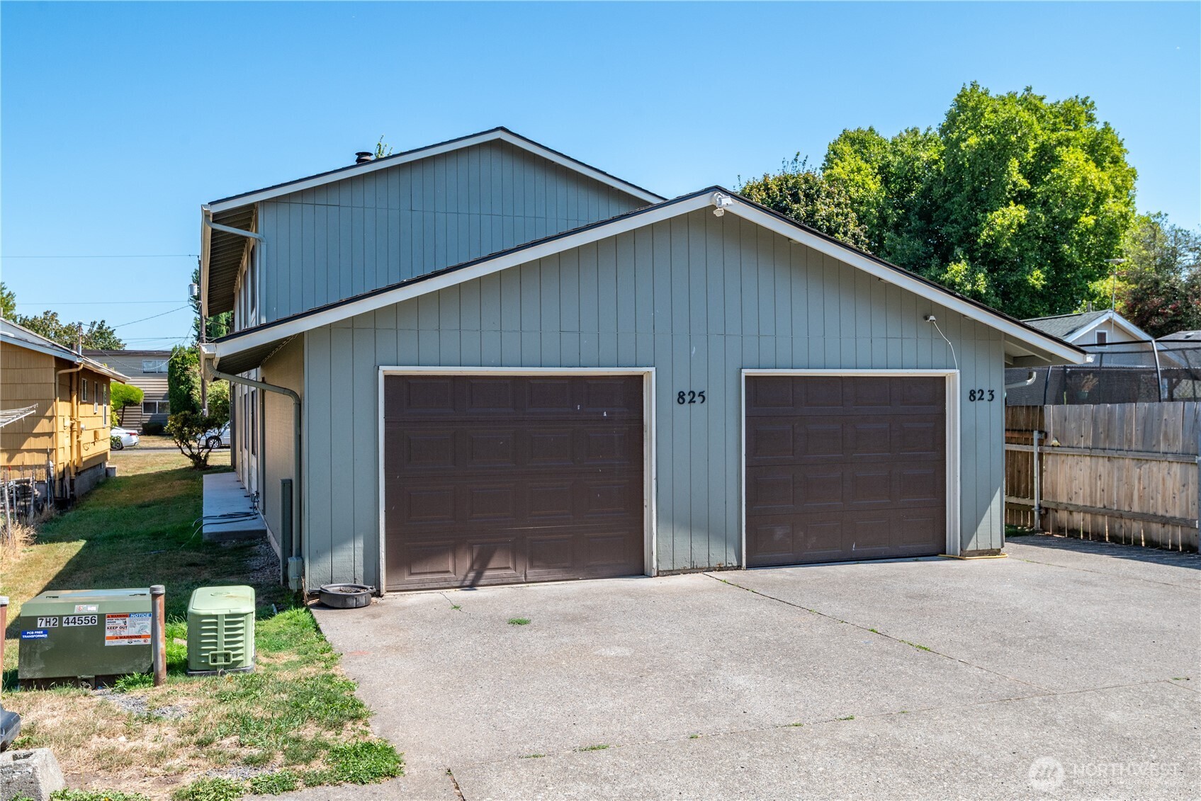 823 8th Avenue Longview, WA 98632 - Photo 6 of 18 a front view of a house with a yard and garage
