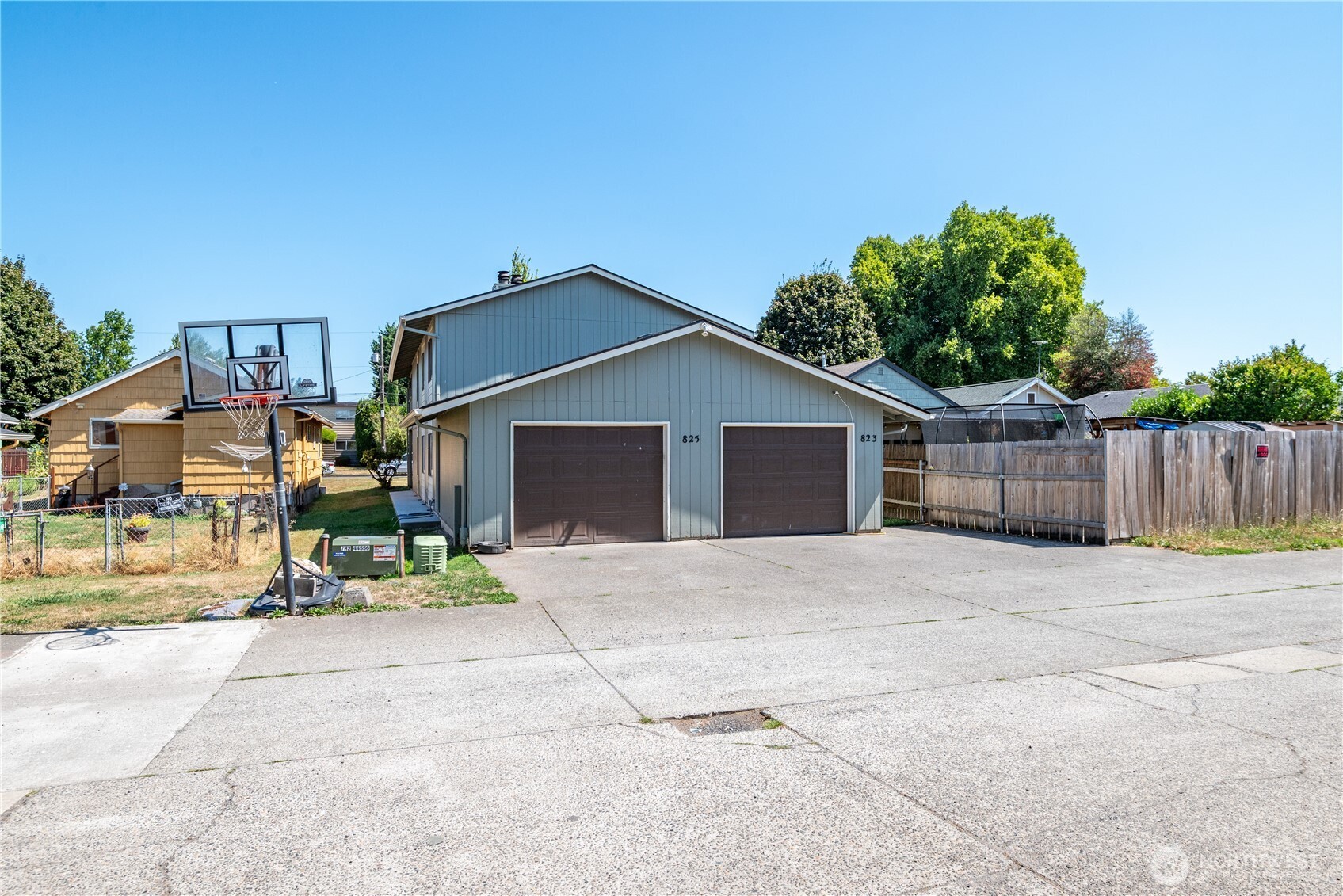 823 8th Avenue Longview, WA 98632 - Photo 7 of 18 a front view of a house with a yard and garage