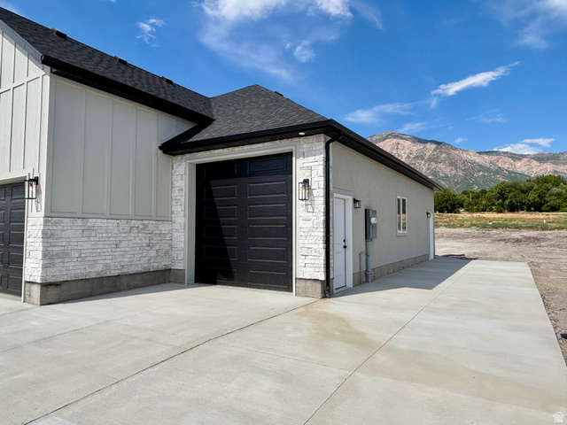 1184 West 3250 North Ogden, UT 84414 - Photo 4 of 69 Large 3rd car garage - extra height, man door located on the side of the garage. Large extended RV to the side