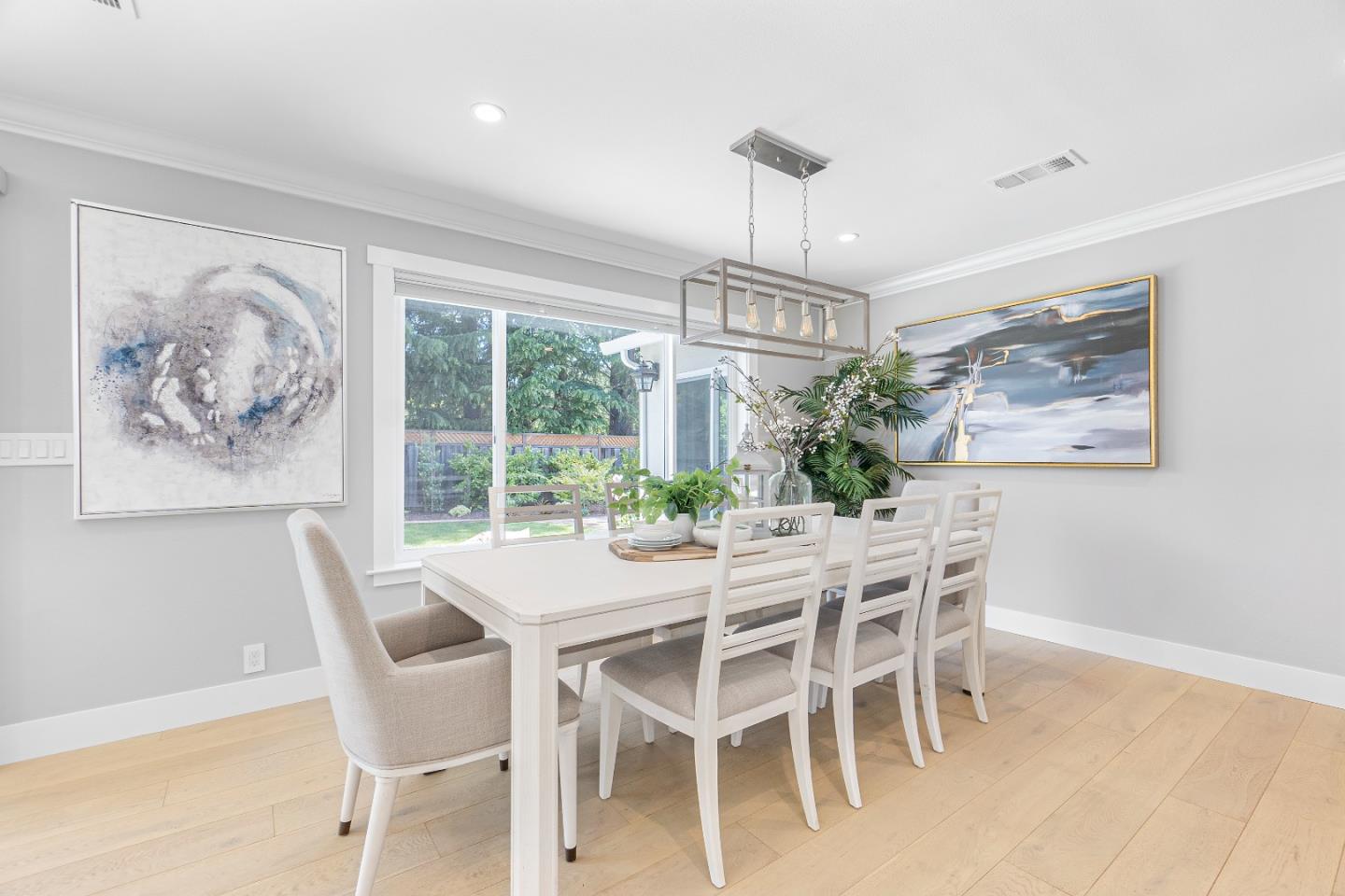 928 Manor Way Los Altos, CA 94024 - Photo 12 of 41 a view of a dining room with furniture large windows and wooden floor