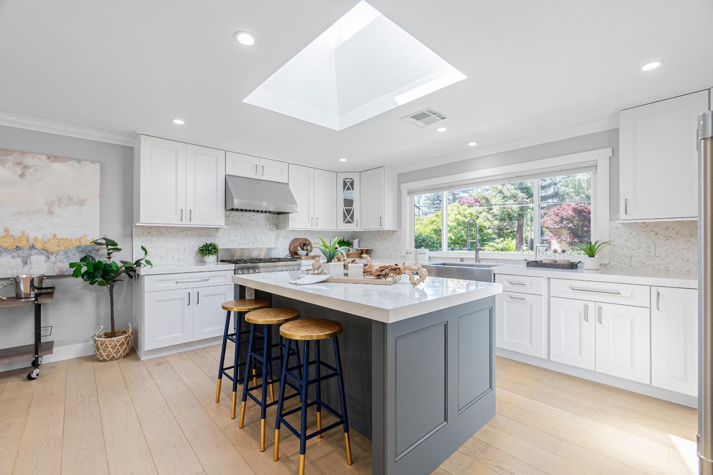 928 Manor Way Los Altos, CA 94024 - Photo 14 of 41 a kitchen with sink a window and chairs