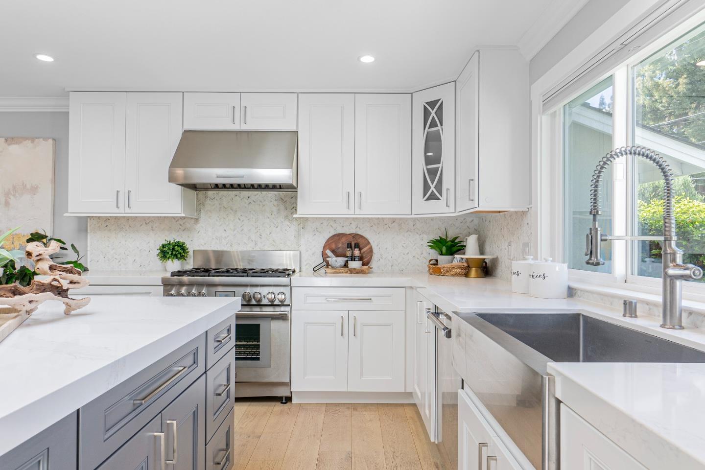 928 Manor Way Los Altos, CA 94024 - Photo 15 of 41 a kitchen with a sink a stove and cabinets