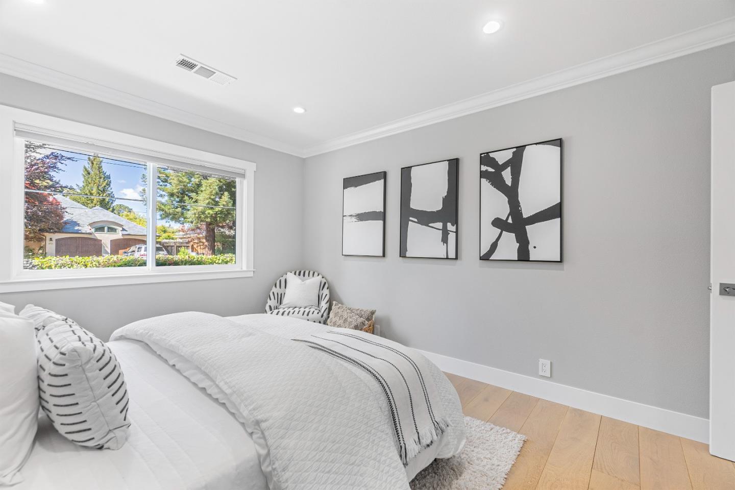 928 Manor Way Los Altos, CA 94024 - Photo 19 of 41 a bedroom with a bed and a painting on the wall