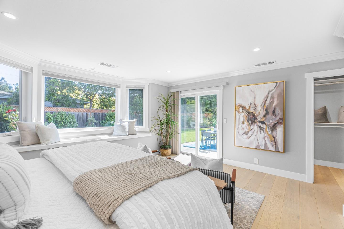 928 Manor Way Los Altos, CA 94024 - Photo 26 of 41 a bedroom with a large bed and a large window