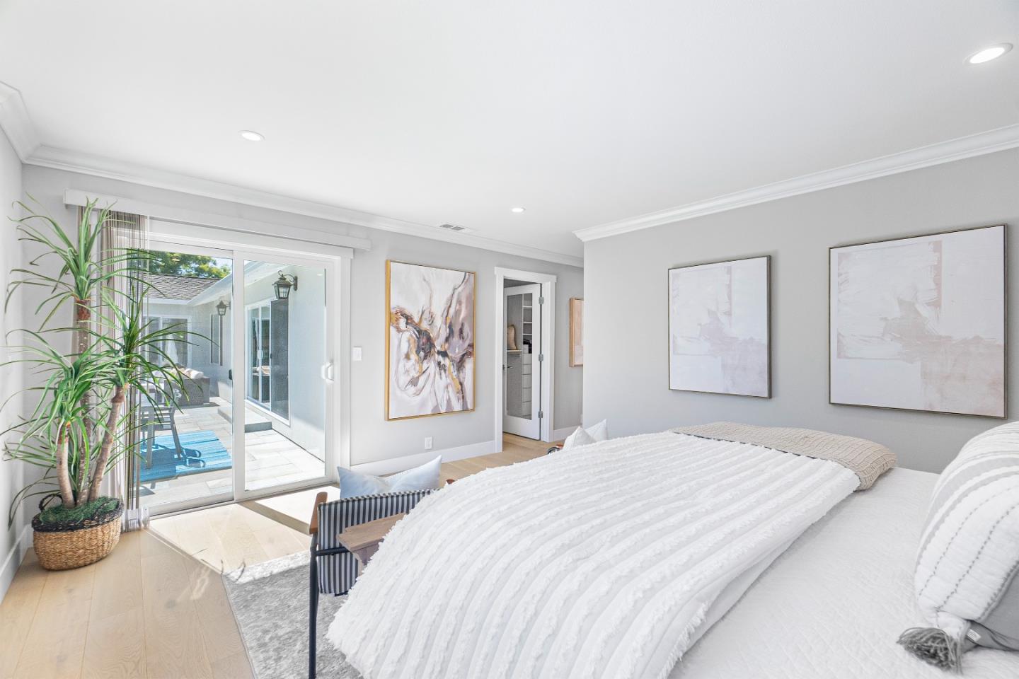 928 Manor Way Los Altos, CA 94024 - Photo 28 of 41 a bedroom with a large bed and a painting on the wall