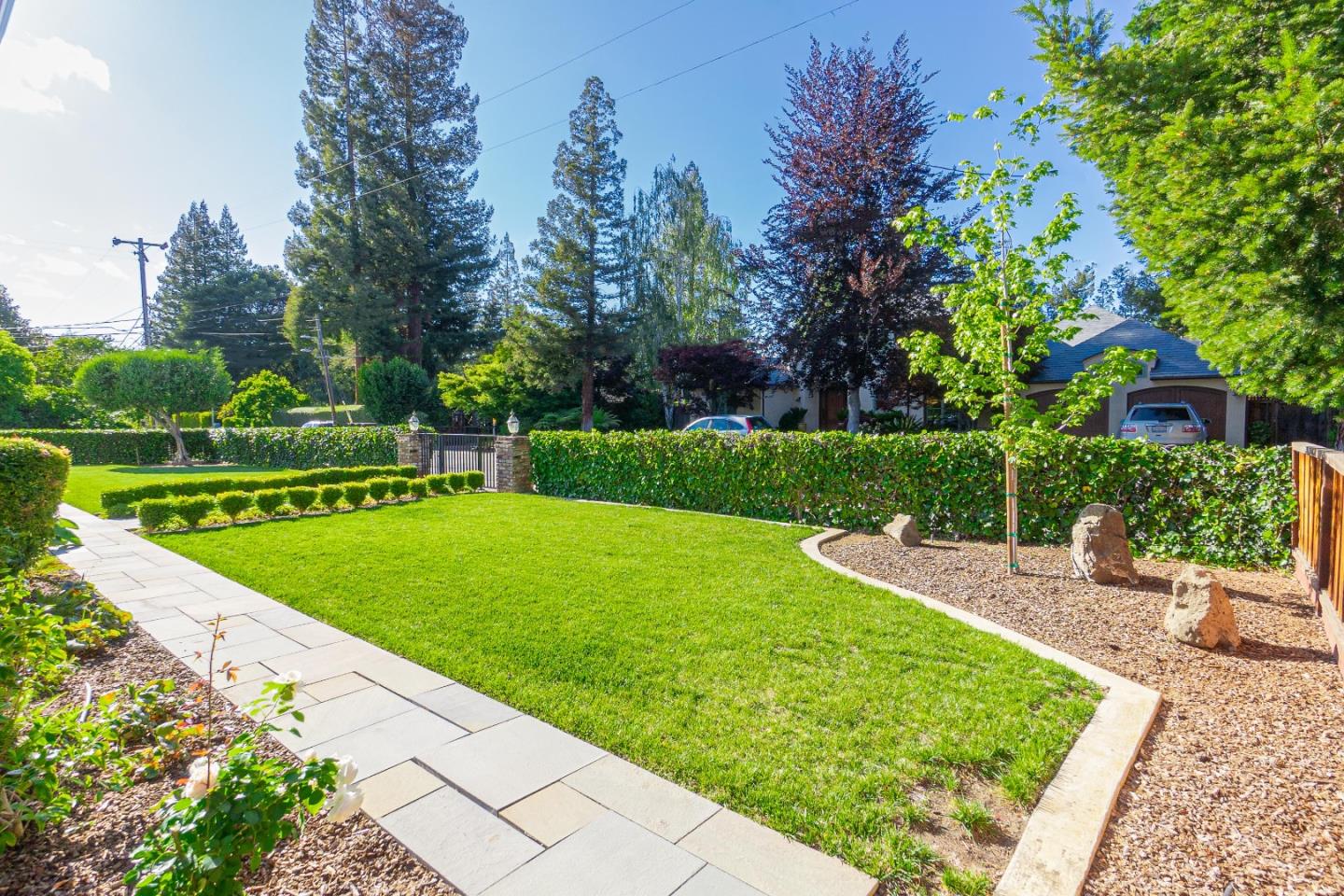 928 Manor Way Los Altos, CA 94024 - Photo 3 of 41 a view of a garden with houses