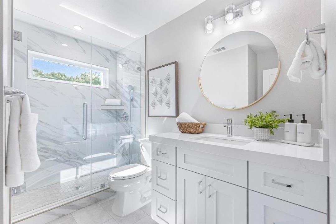 928 Manor Way Los Altos, CA 94024 - Photo 37 of 41 a bathroom with a toilet a sink and mirror